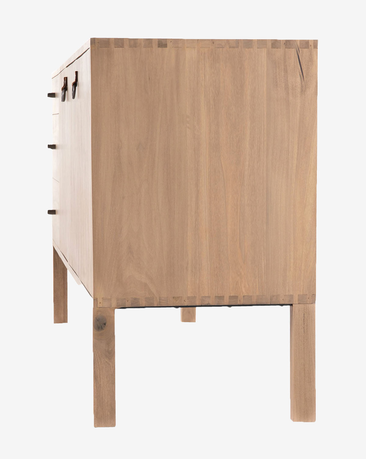 The Daylin Sideboard, shown from the side, features a smooth light wood finish and a shaker-inspired rectangular shape with dovetail joints, four straight legs, and partially visible front handles on the left, by McGee & Co.