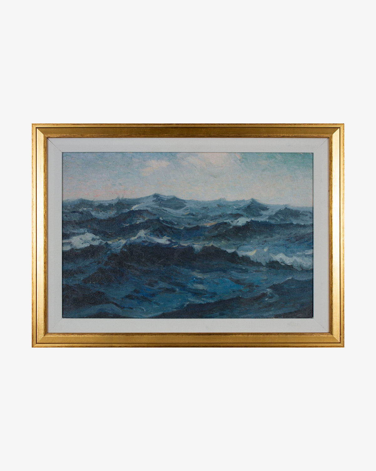 The Deep Blue Waves framed painting showcases a stormy sea with dark blue waves beneath a cloudy sky. Gallery-quality, it features a gold frame with a white inner border, highlighting the dramatic water and empty horizon.
