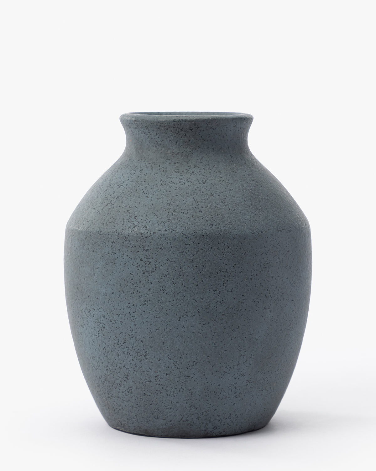 The Delgado Vase is a matte dark gray piece featuring a wide rounded body, narrow neck, and slightly flared rim, displayed on a plain white background, by McGee & Co.