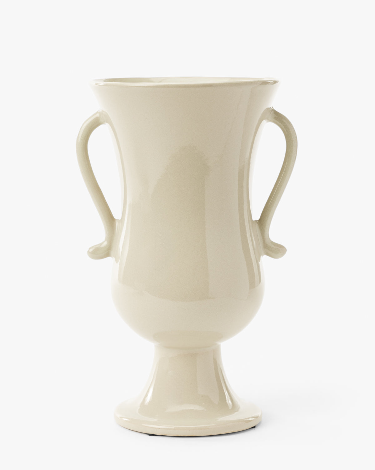 The Delphine Footed Vase is a glossy, cream-colored ceramic piece featuring two curved handles, a wide flared rim, rounded body, and narrow pedestal base, shown against a white background, by McGee & Co.