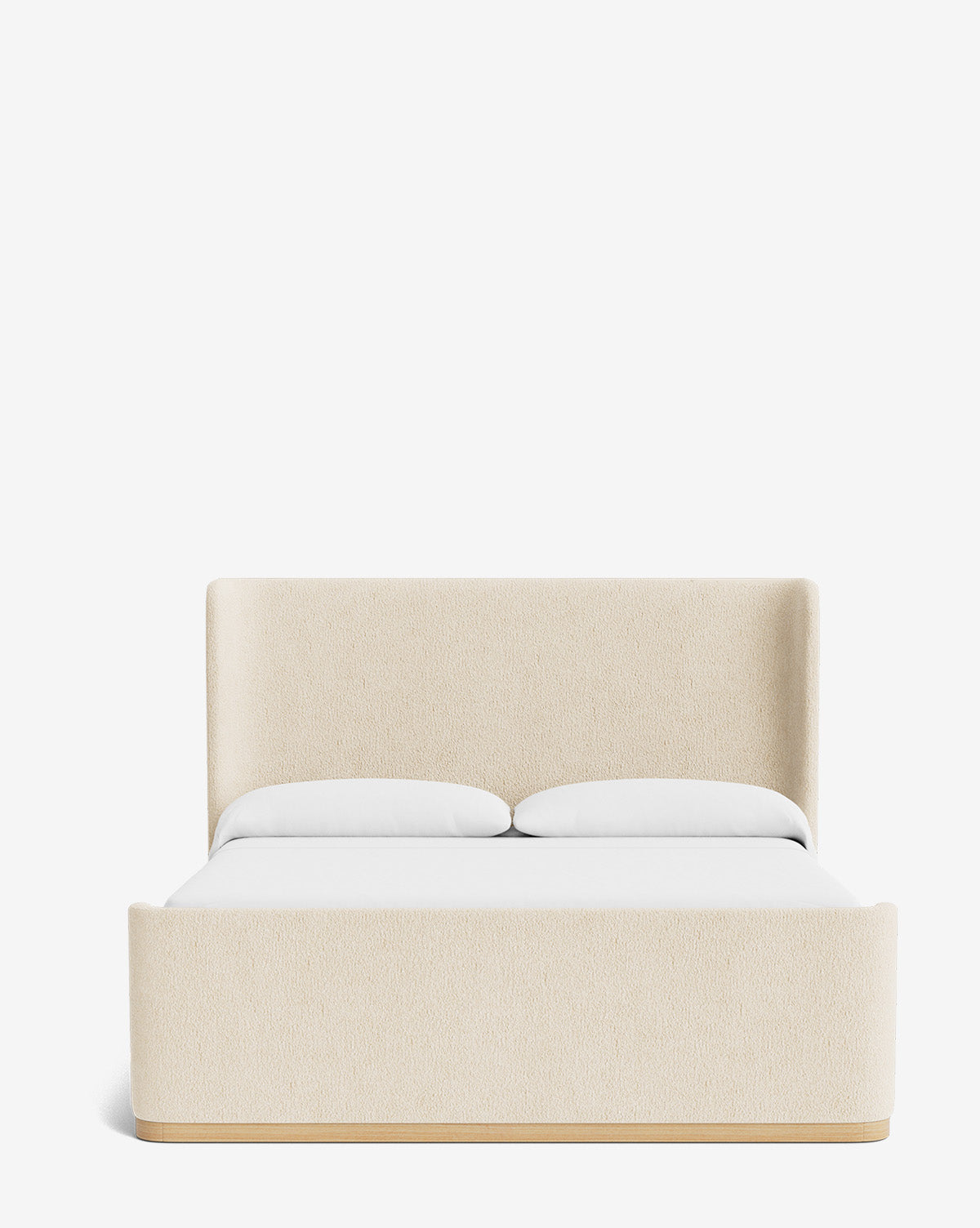 The Denning Upholstered Bed by Makerspalm is a modern, cream-colored bed with a tall headboard, matching footboard, solid wood frame, and luxe fabric. Shown dressed in white bedding and two pillows against a plain white background. Ready to ship—similar in style to offerings from McGee & Co.