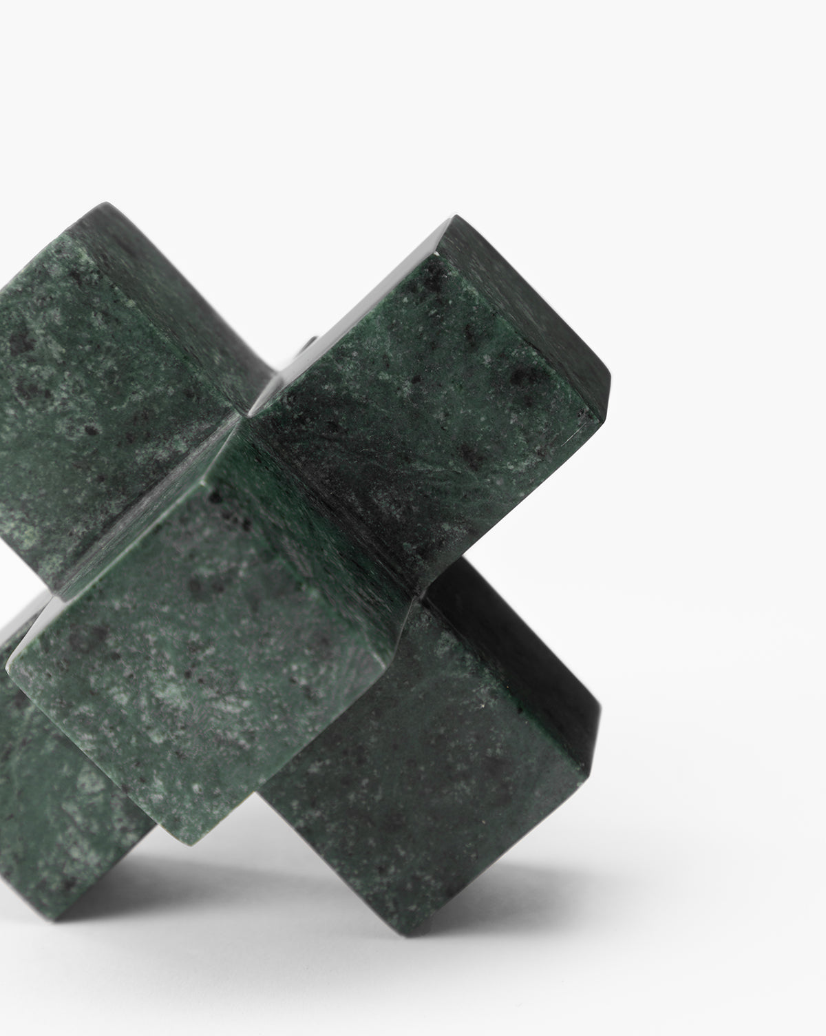 A close-up of the Diani Marble Cuboid Object—a green geometric sculpture with intersecting rectangular blocks, set against a white background—ideal sculptural decor for contemporary homes.
