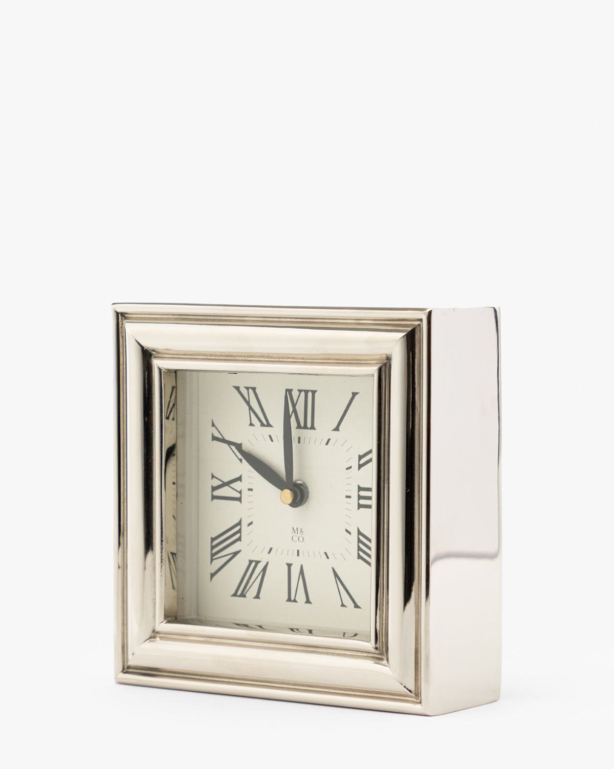 A Draper Clock in polished nickel with Roman numerals and black hands is shown against a plain white background, displaying the time as 11:01, by McGee & Co.