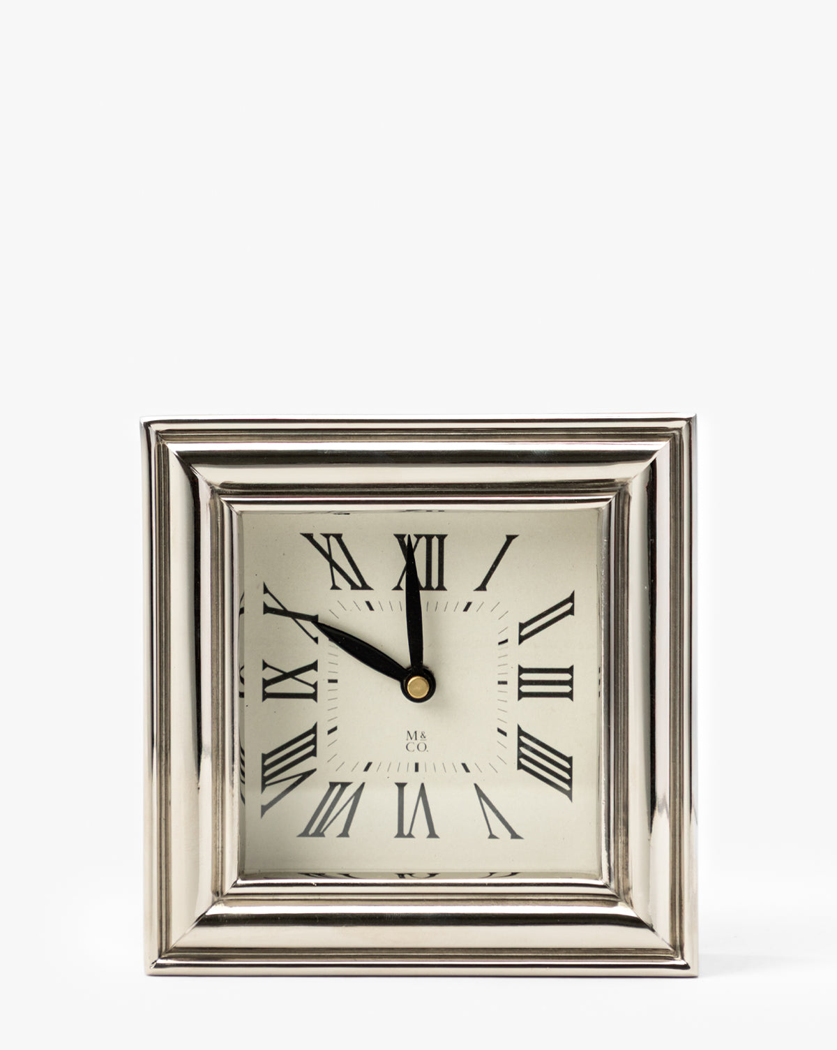 The Draper Clock, featuring a polished nickel finish, silver frame, and Roman numerals, shows the time 10:56 against a white background, by McGee & Co.