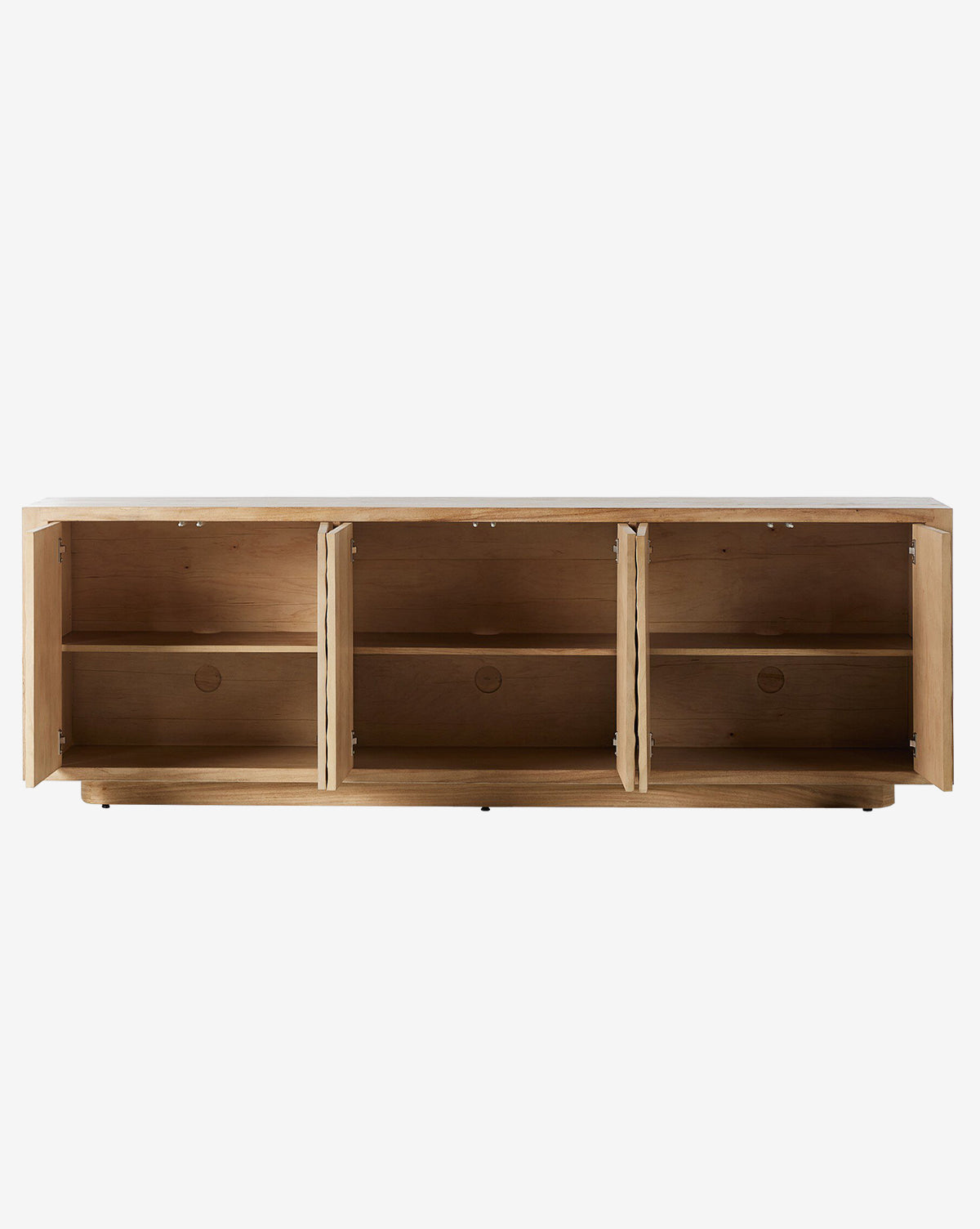 The Drayton Sideboard is a wooden storage cabinet with three open compartments, each with a shelf and textured doors. Shown against a plain white background, the entryway furniture has its doors open, revealing empty interiors by McGee & Co.