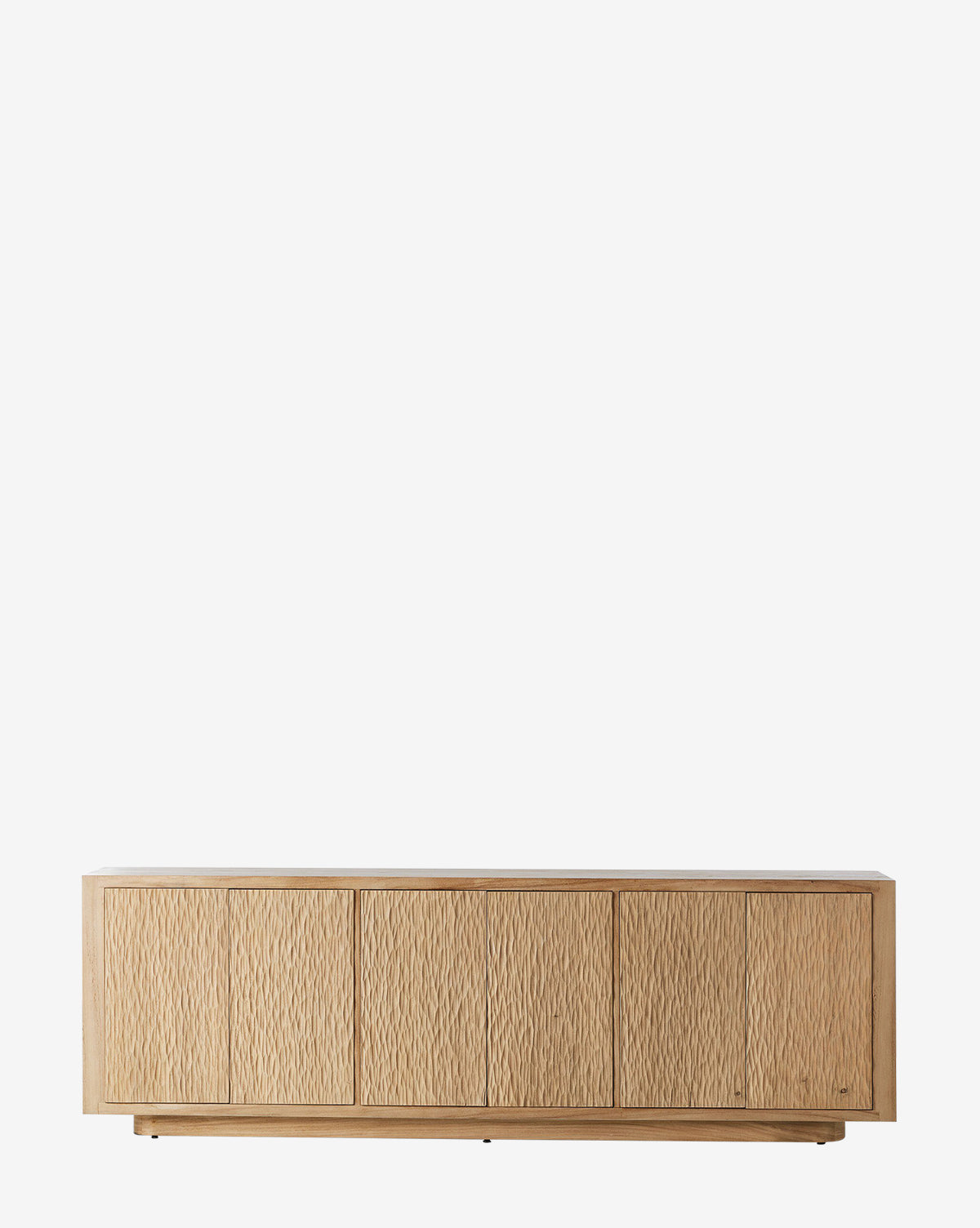 The Drayton Sideboard features a low, rectangular design with five textured doors and a natural light wood finish. Stylish and functional, it’s ideal for entryways and is shown here against a plain white background by McGee & Co.