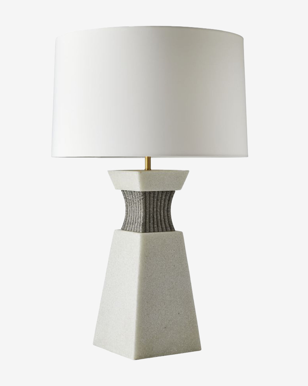 The Dynasty Table Lamp boasts a modern stone base with a textured dark gray top section and is finished with a wide, tapered off-white shade for a sleek, contemporary style, by McGee & Co.