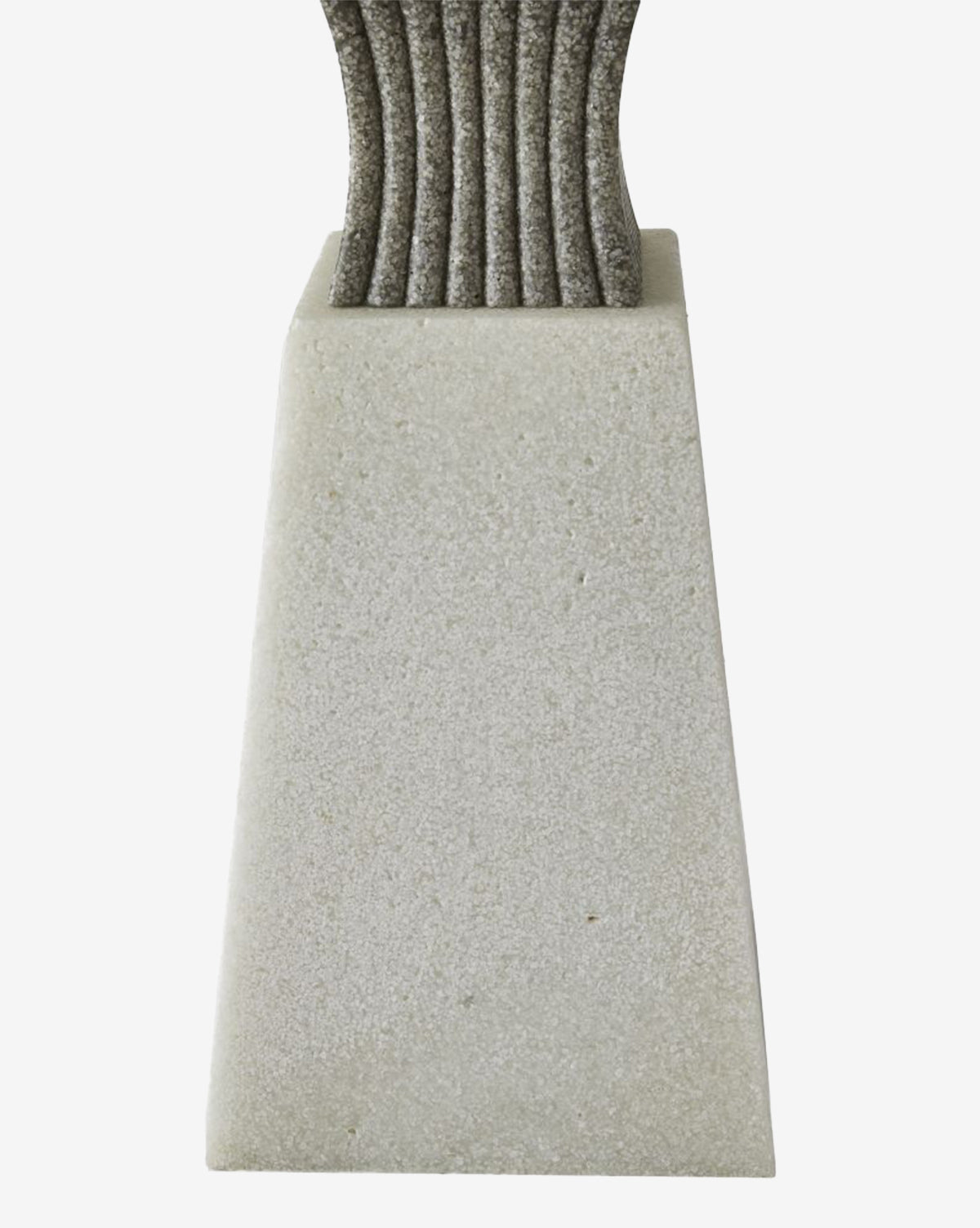 A close-up shows the textured stone base of the Dynasty Table Lamp, highlighting its vertical grooves and set against a white background, by McGee & Co.