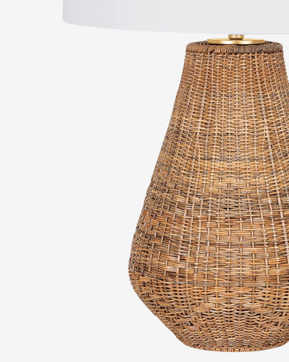 A close-up of the Eastbridge Abaca Table Lamp, featuring a woven abaca base and a partially visible white linen shade, set against a plain white background by McGee & Co.