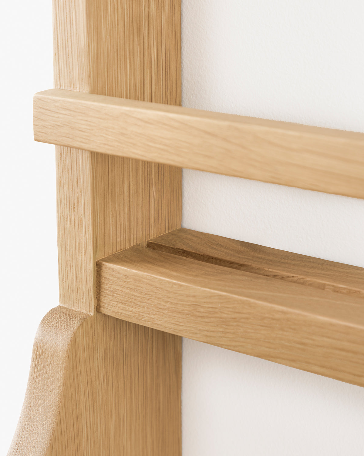 Close-up of the Edna Kitchen Shelf, featuring a smooth natural finish and minimalist open shelving design with straight lines, mounted on a white wall, by McGee & Co.