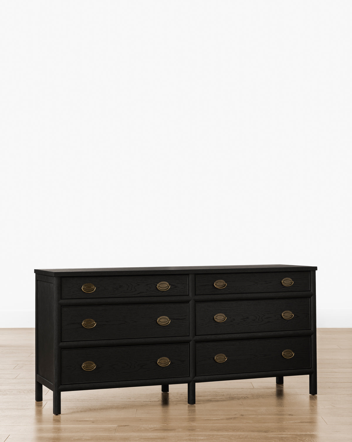 The Edward Dresser features six spacious drawers with round brass handles, offering elegant bedroom storage, by McGee & Co.