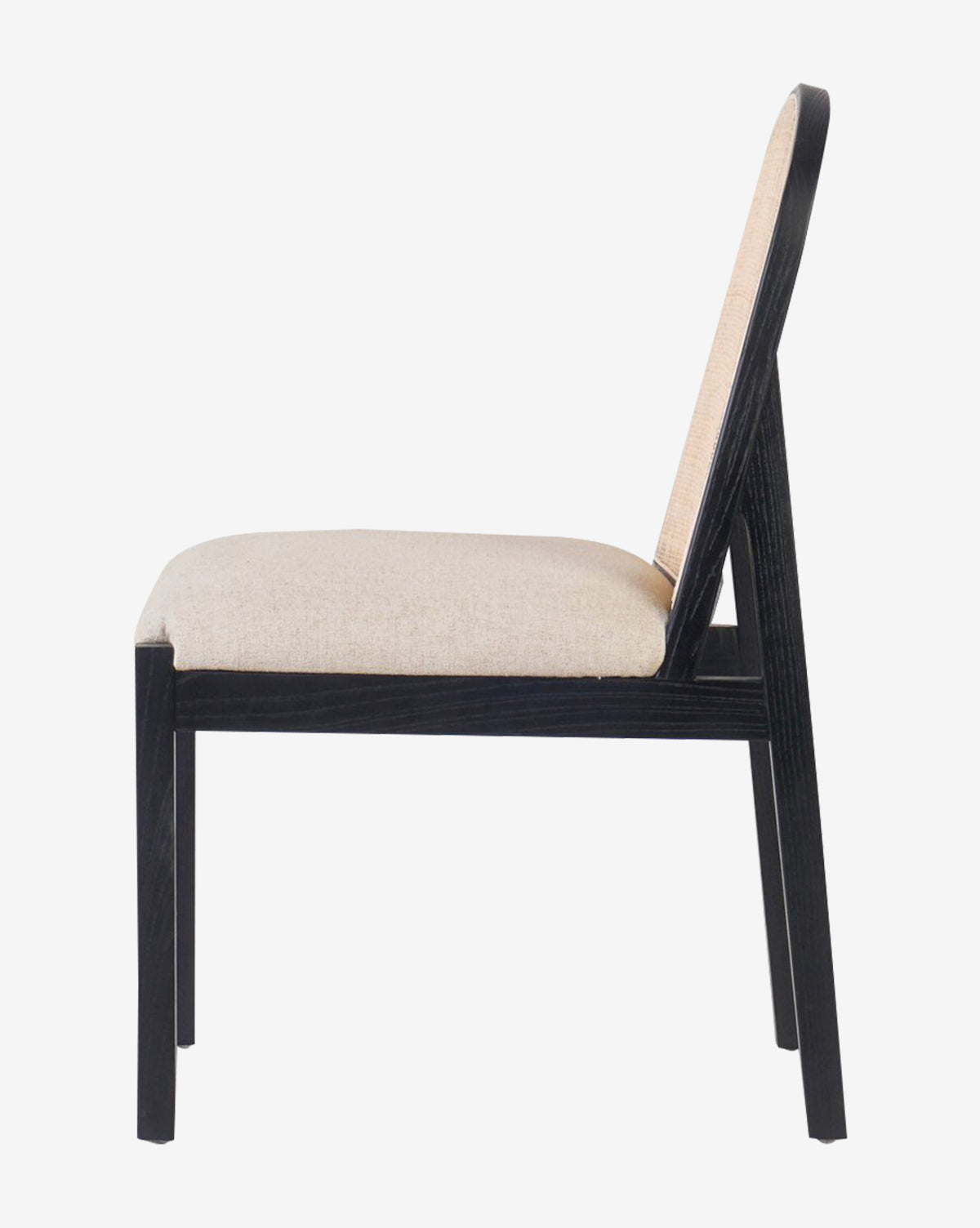 Side view of the Eira Dining Chair featuring a beige performance fabric seat, cane backrest, and black wooden frame, displayed against a plain white background by McGee & Co.