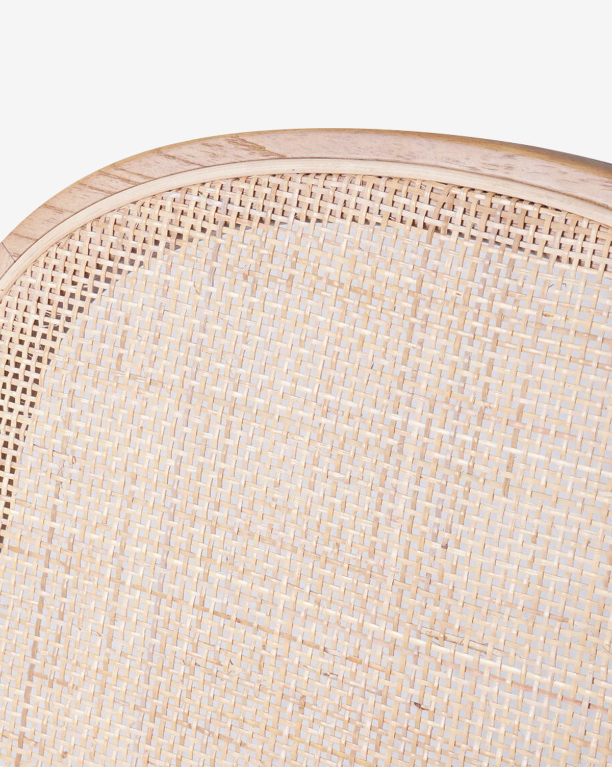 Close-up of the Eira Dining Chair, showcasing its light wood curved frame and cane backrest, with highlighted details set against a plain white background, by McGee & Co.