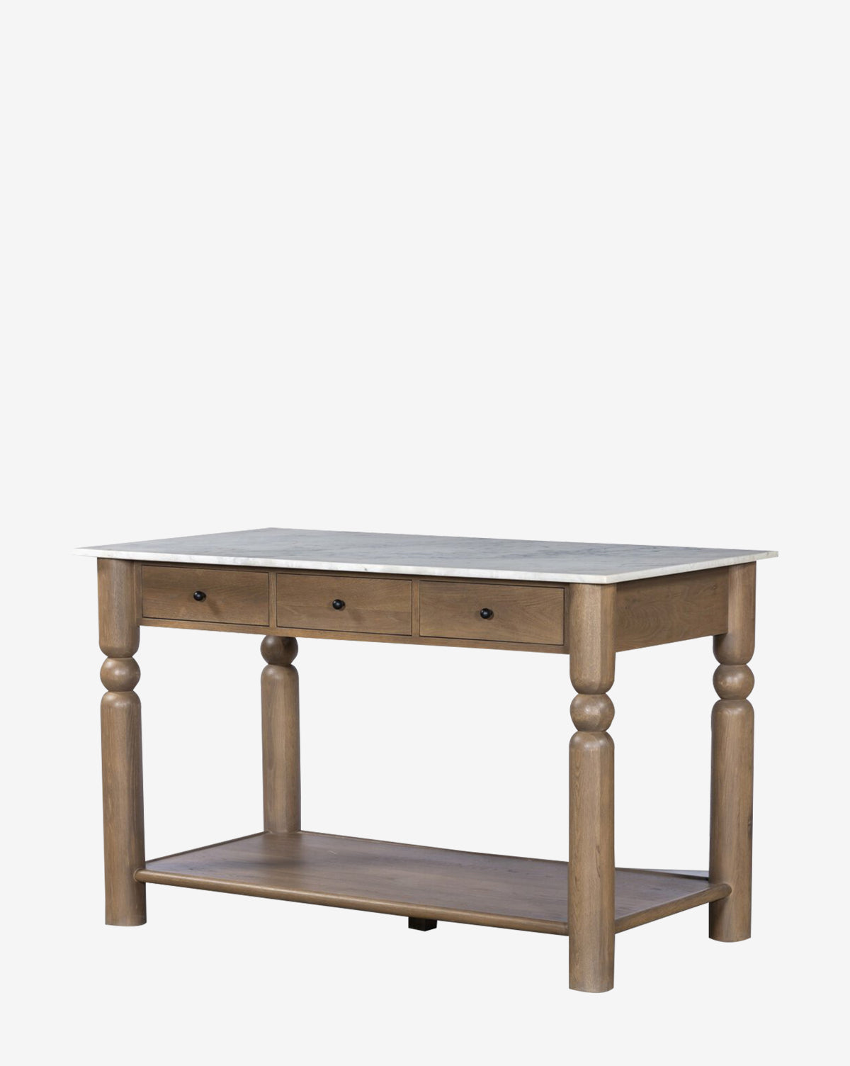 The Eldric Kitchen Island has a solid oak base, white marble top, three drawers with dark knobs, turned legs, and a lower storage shelf. Its design is simple and classic by McGee & Co.