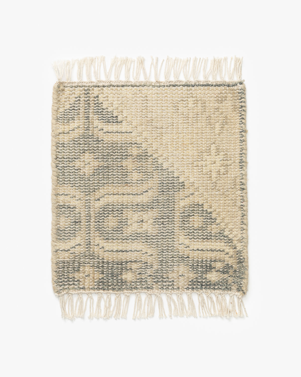 The Elin Hand-Knotted Rug Swatch is a square woven sample with fringed edges, artisan details, and beige and gray geometric patterns on a white background, inspired by traditional textiles, by McGee & Co.