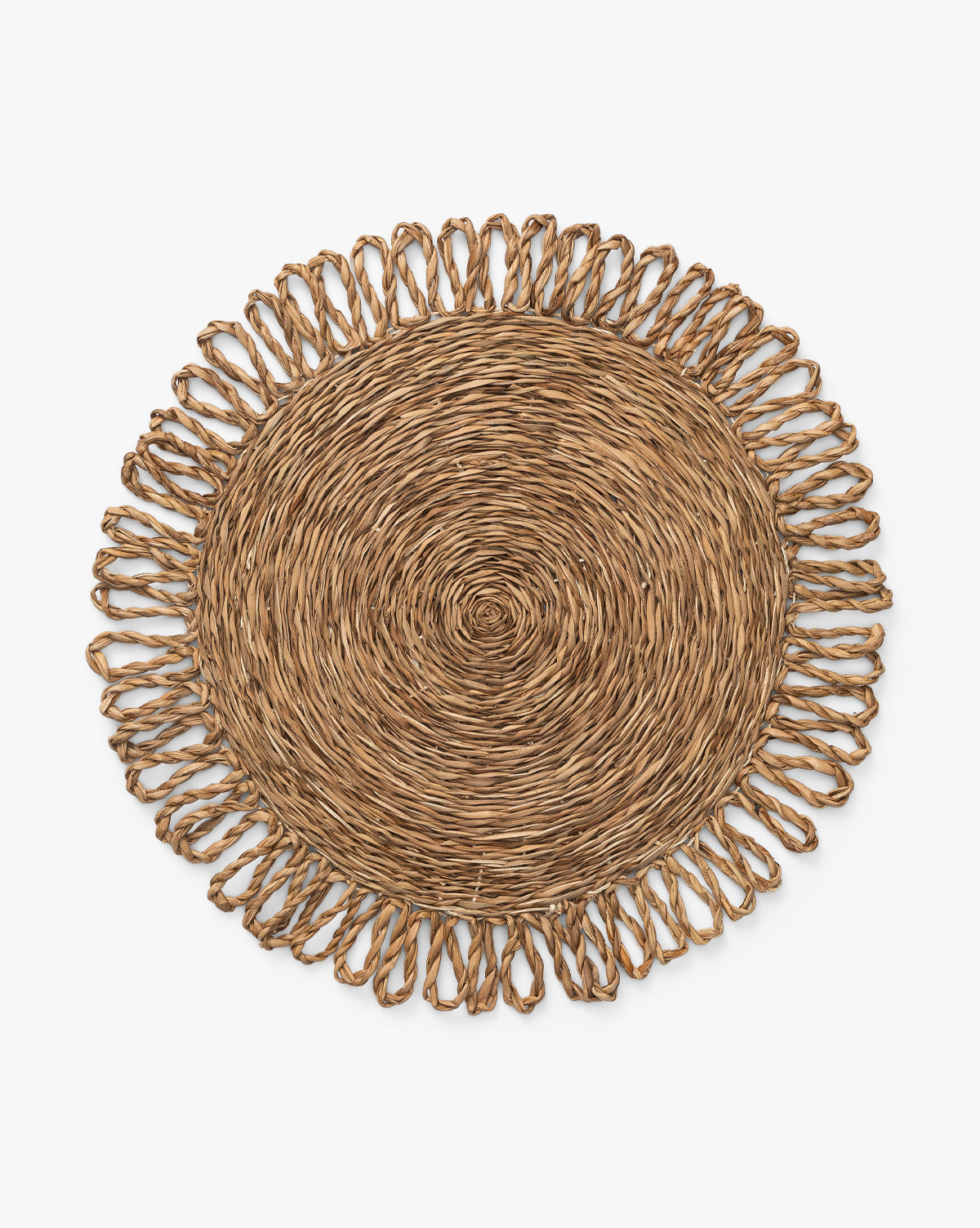 The McGee & Co. x Loeffler Randall Elise Seagrass Placemat features natural brown woven seagrass with a spiraled center and decorative looped, fringe-like edge—ideal for stylish tablescapes. Displayed on a white background by McGee & Co.