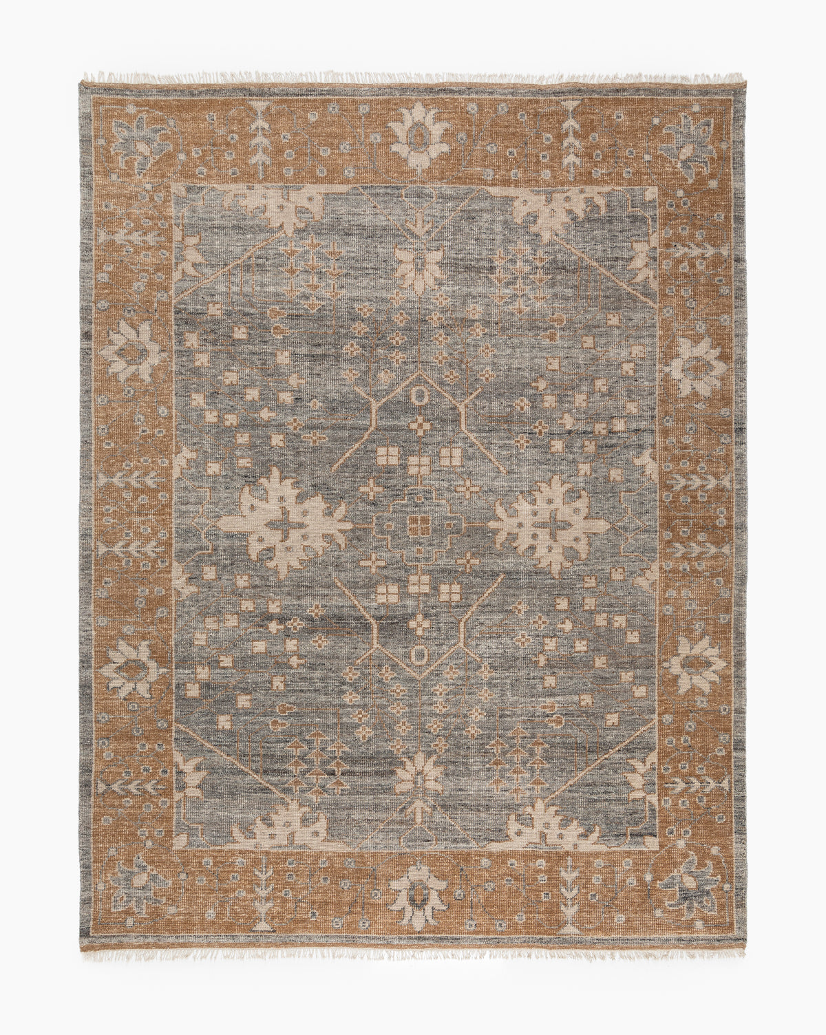 The Elison Hand-Knotted Wool Rug features a gray center, brown border, and intricate beige and light brown floral and geometric patterns. Inspired by traditional textiles, it has artisan fringed edges on the shorter sides, by McGee & Co.