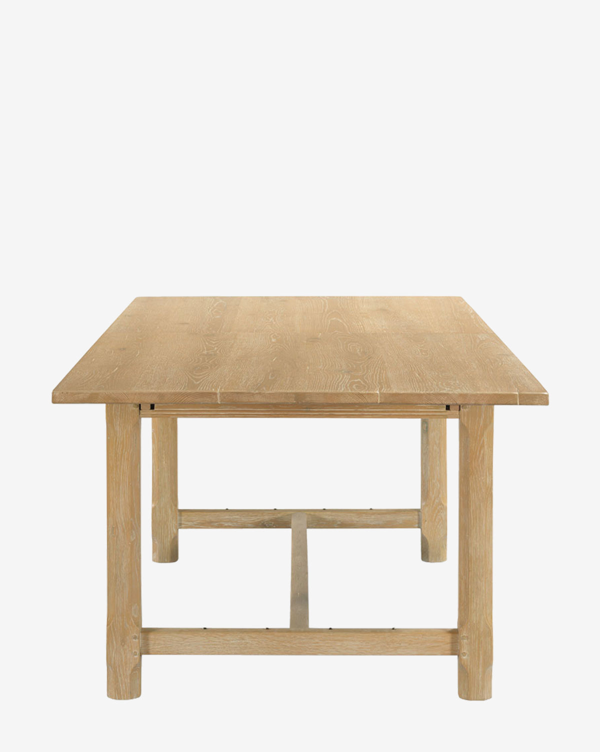 The Elliot Extension Dining Table, crafted from light wood with a sturdy, simple design and crossbar supports, features a rectangular shape and is shown against a plain white background by McGee & Co.