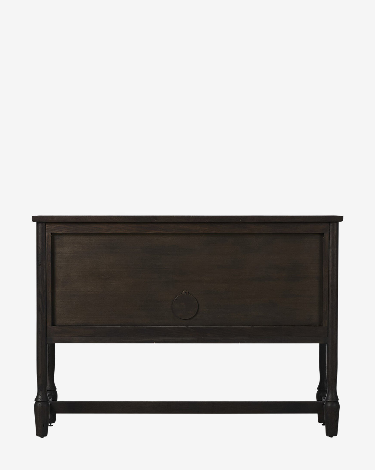 The Elmer Sideboard is a dark wooden storage chest with a rectangular design, panel front, decorative metal pull, short legs, and a cracked smoked black veneer, shown against a plain white background by McGee & Co.