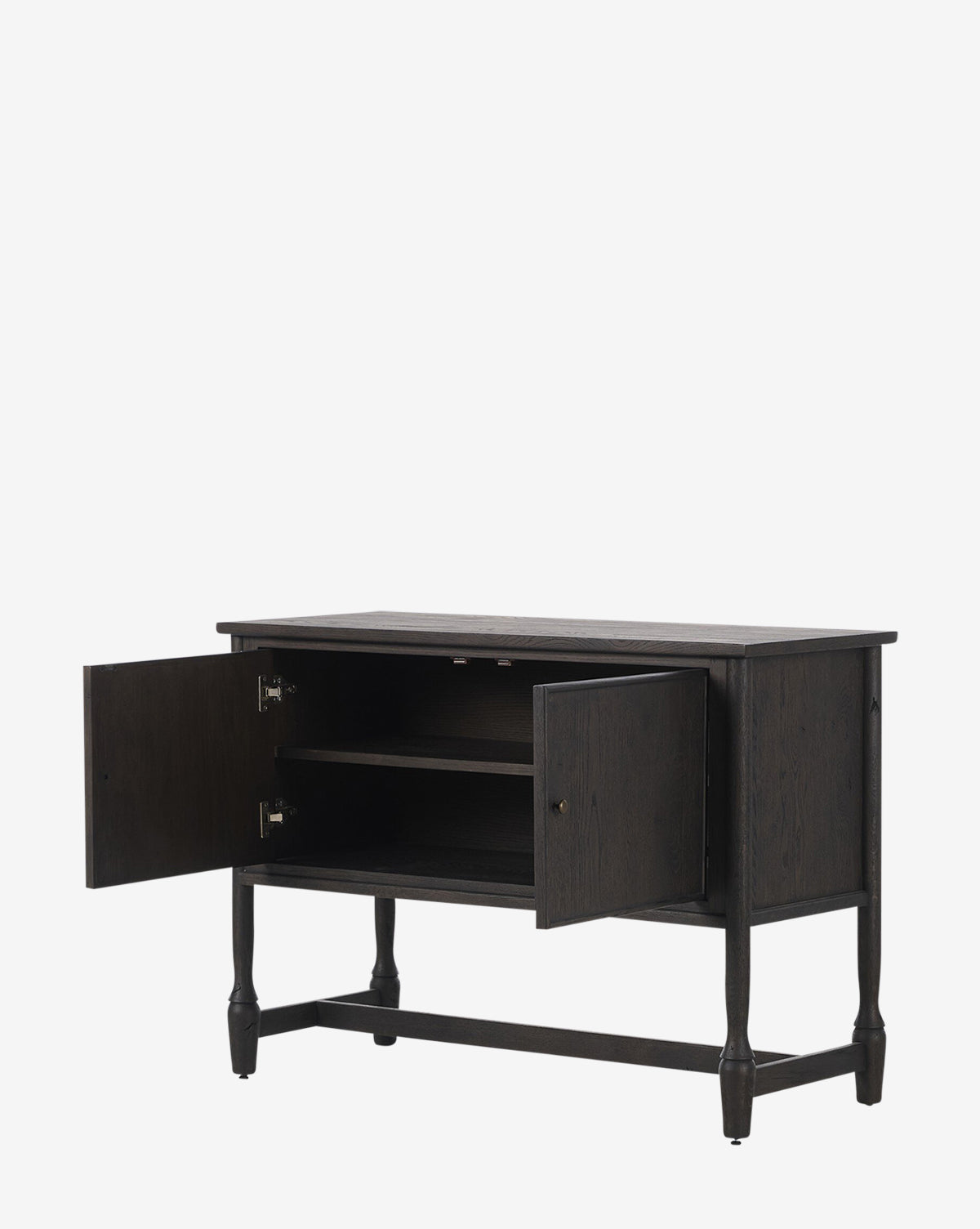 The Elmer Sideboard is crafted from solid oak with a cracked smoked black veneer. It features two cabinet doors with an interior shelf and stands on four legs with a crossbar for sturdy support, by McGee & Co.