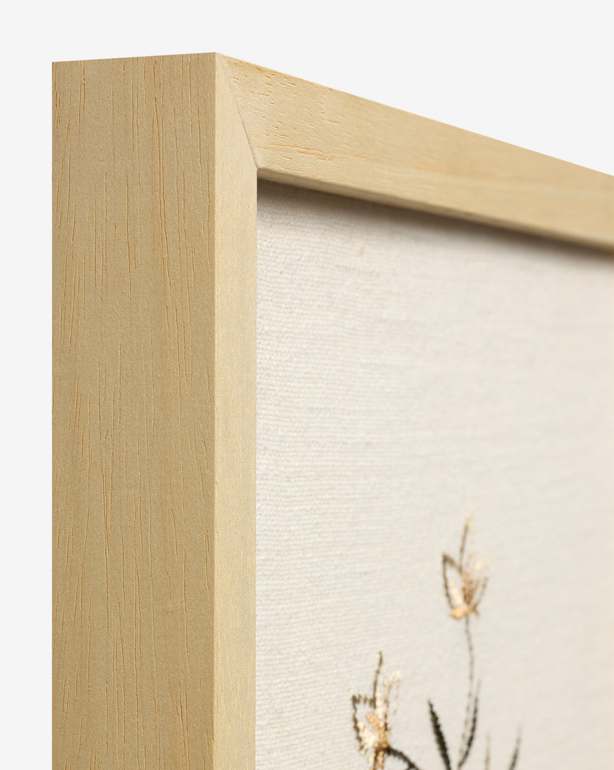 Close-up of the Embroidered Pixie Flowers, a light wood-framed canvas with embroidered flowers on cream fabric—ideal as cotton wall decor to bring botanical charm to your space by McGee & Co.