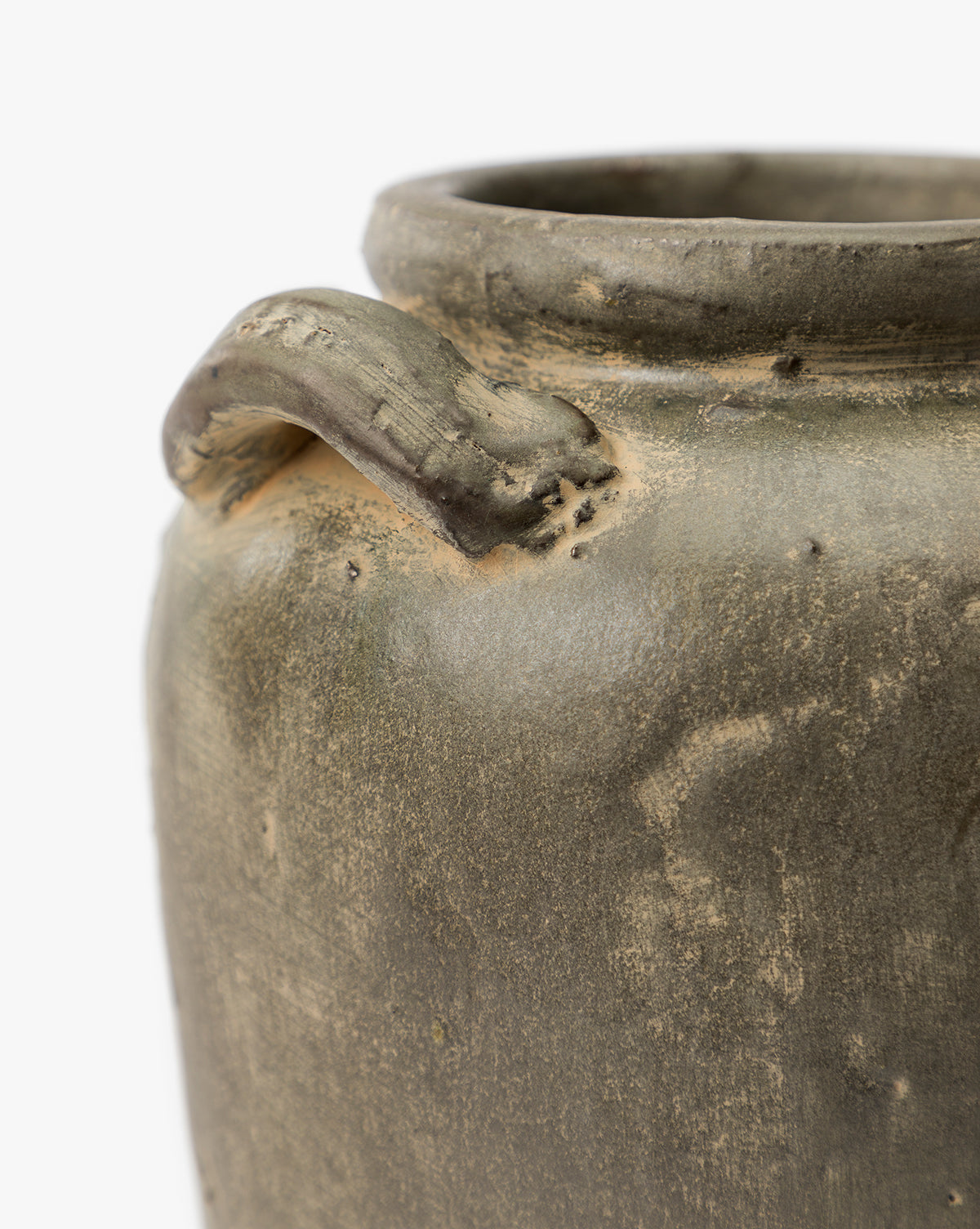A close-up of the Emilio Urn, a rustic ceramic pot with a small curved handle near the rim. Its earthy texture and greenish-brown hue make it an ideal vintage home decor accent or shelf accessory against a white background, by McGee & Co.
