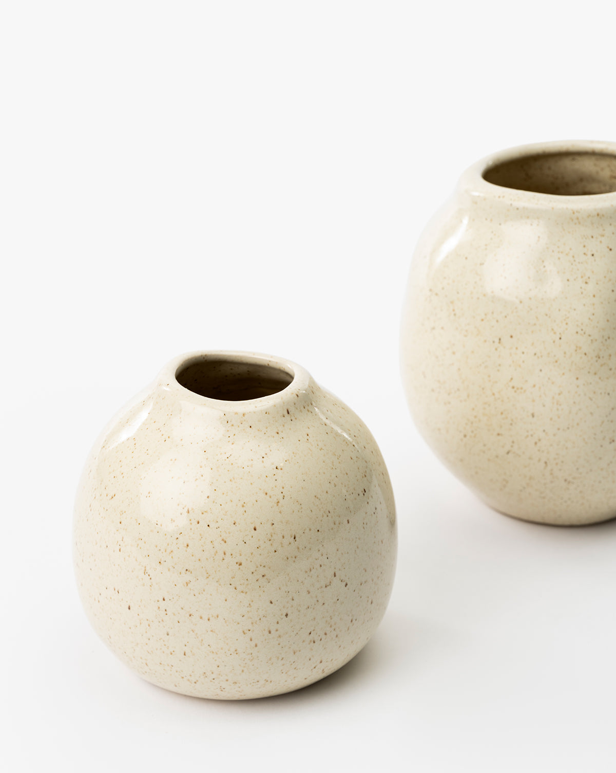 One vase is in front, with the second partially visible behind, by McGee & Co.