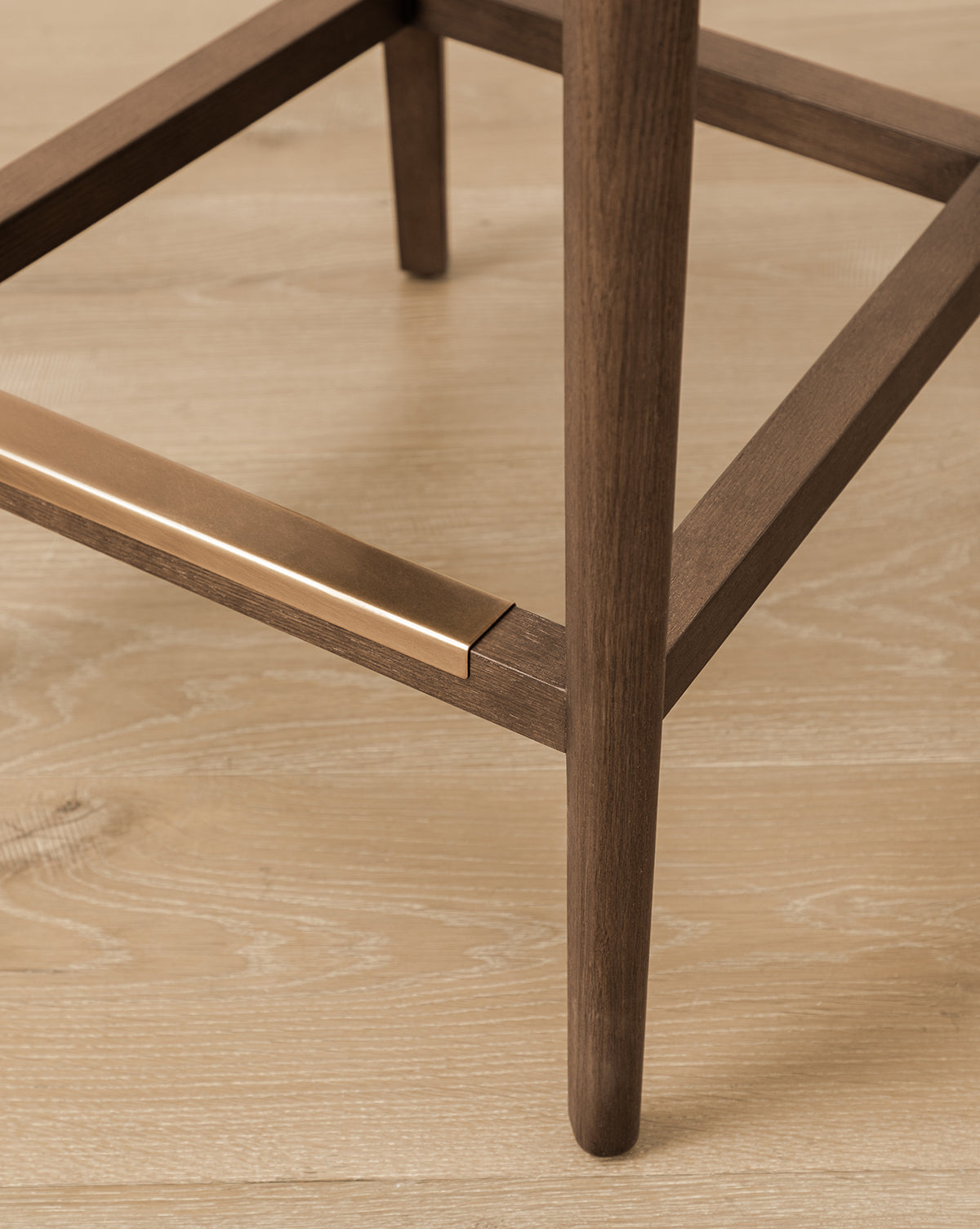 Certainly! Here’s how you can blend the exact string McGee & Co. into your description, placing it at the end as requested: Close-up of the Makerspalm Etienne Stool (Ready to Ship), showing its wooden leg with a brass footrest on light wood flooring. This stool blends vintage inspiration with a modern, minimalist design featuring clean lines and smooth textures. McGee & Co. Let me know if you’d like the name incorporated differently within or formatted in another way!.