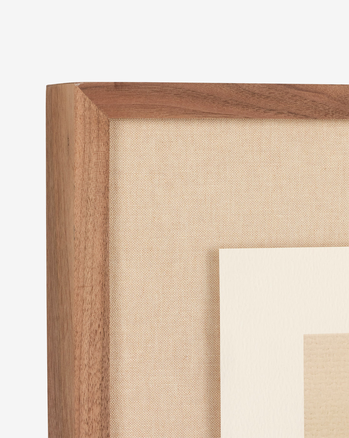 Close-up of the top left corner of a walnut frame with a beige fabric mat and white inner border, perfect for displaying Abstract Ombre No. 5 by Roseanne Kenny, set against a white background.