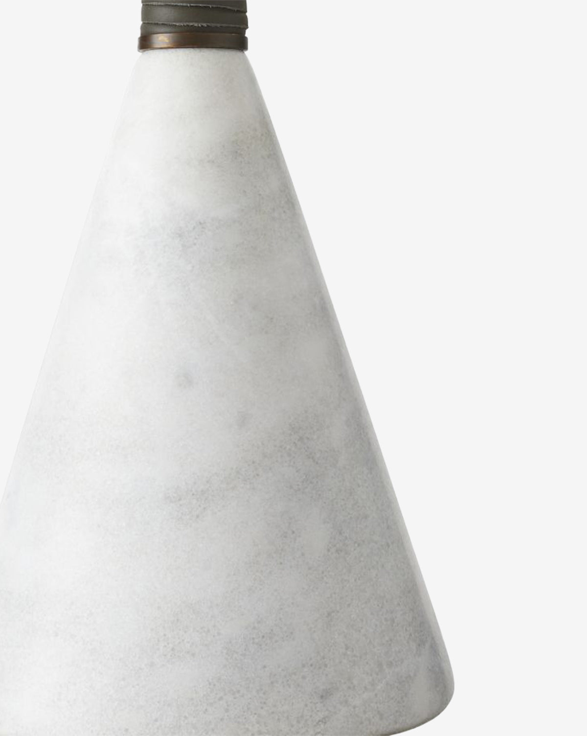A close-up of the Everly Table Lamp’s white marble cone base, accented by a dark metal ring near the top, shown against a plain white background, by McGee & Co.
