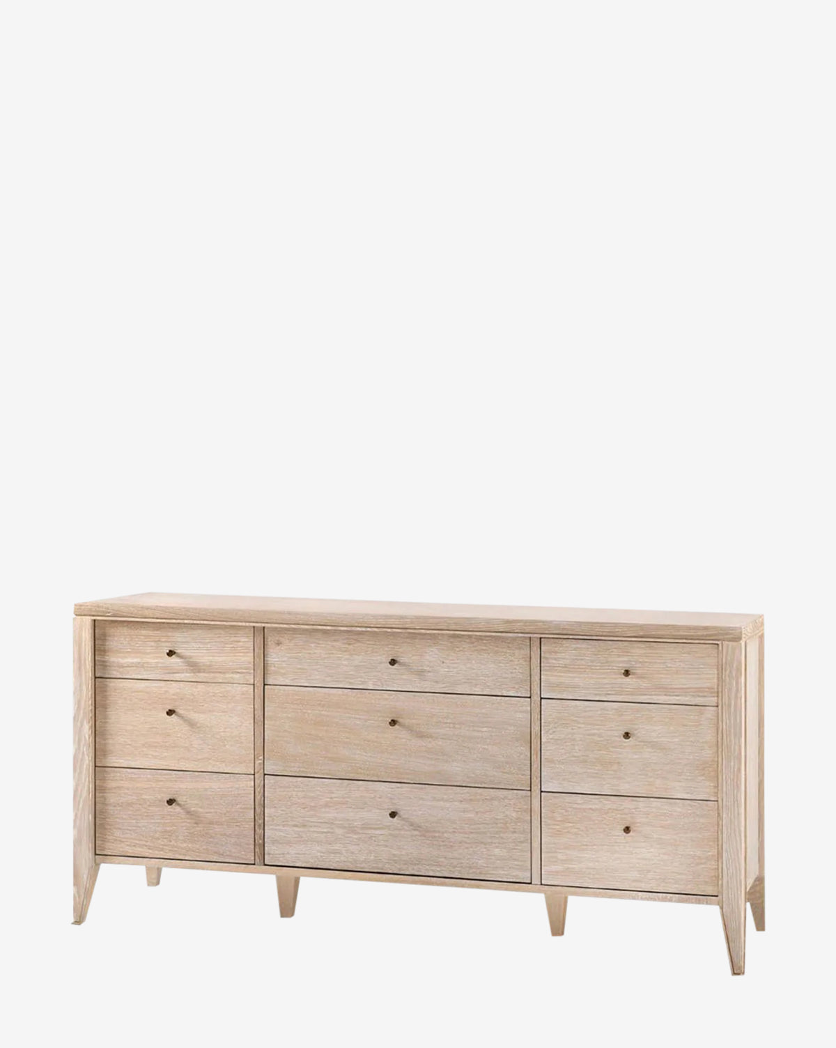 The Falkner Dresser features light wood, nine drawers in three rows and columns, small round knobs, and short tapered legs—capturing French-inspired elegance.
