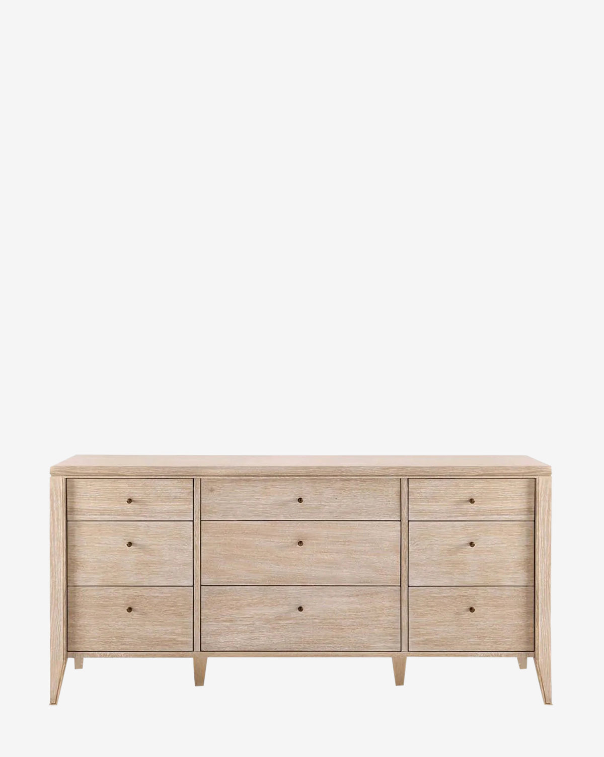 The Falkner Dresser is a French-inspired piece made of light wood, featuring nine drawers in a 3x3 grid, simple round knobs, and short tapered legs—all set against a white background.