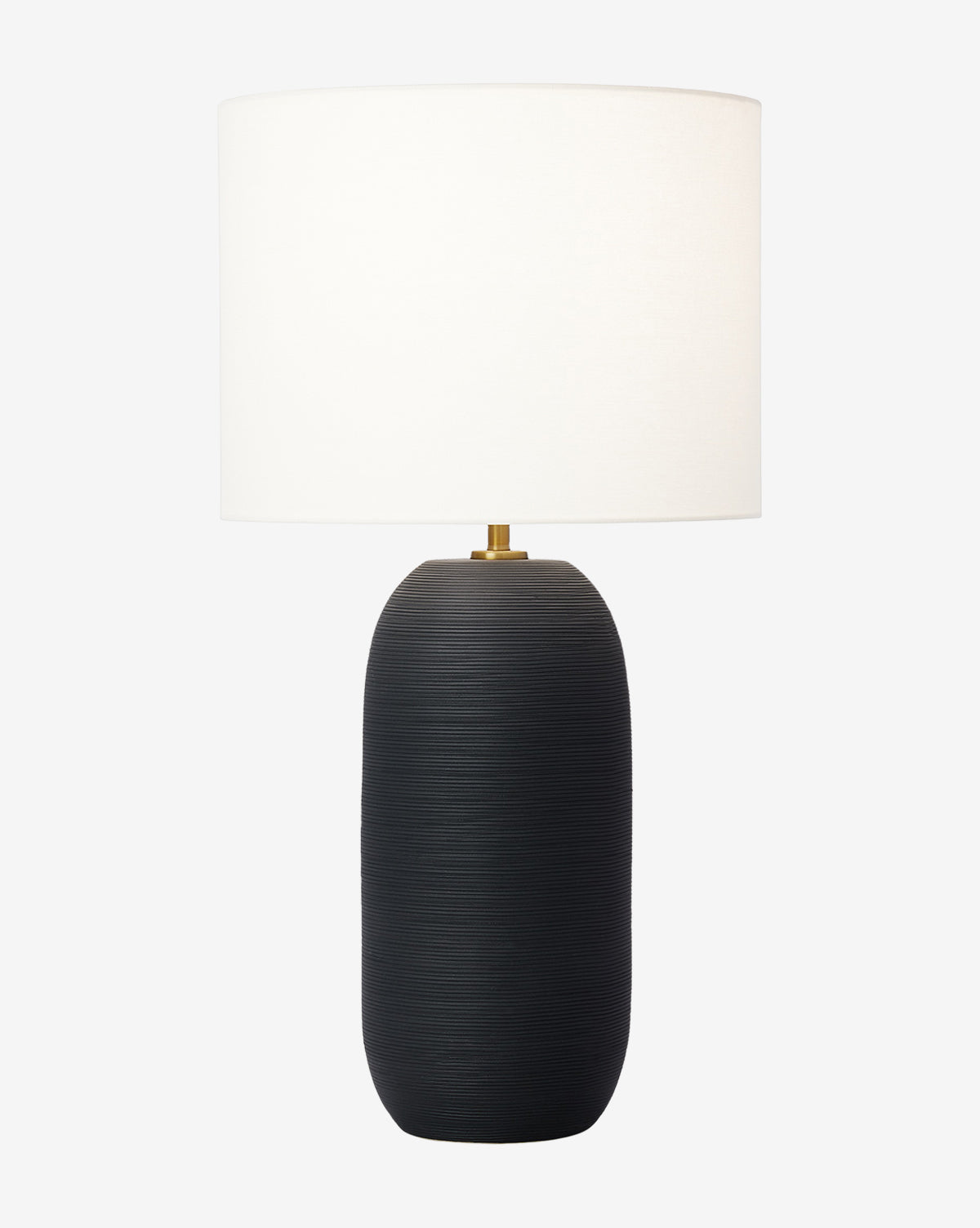 The Fanny Table Lamp features a modern, textured matte black oval ceramic base paired with a large white cylindrical lampshade, shown against a plain white background by McGee & Co.