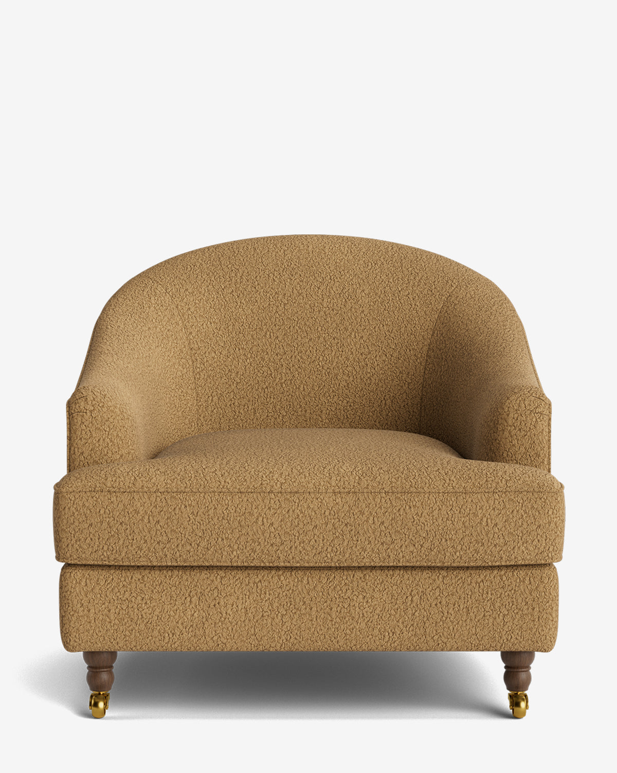 The Fletcher Lounge Chair is a wide armchair with a rounded back and arms, wood legs, and front brass wheels. Upholstered in light brown textured fabric, it’s also available handcrafted in customizable fabrics, by McGee & Co.