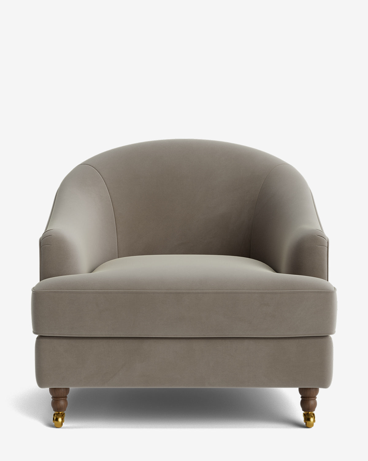 The Fletcher Lounge Chair features a wide, gray velvet seat with a curved back, plush cushion, and short wooden legs—front legs include brass casters, by McGee & Co. Enjoy customizable fabrics for a personalized look.