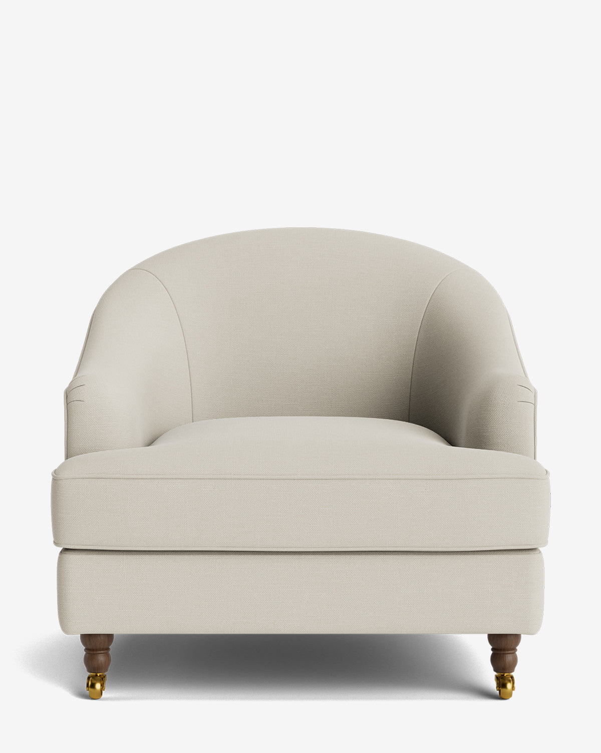 The Fletcher Lounge Chair is a wide, upholstered beige armchair with rounded arms and back, wooden front legs with brass casters, plain back legs, and is handcrafted—shown here from the front against a white background by McGee & Co.