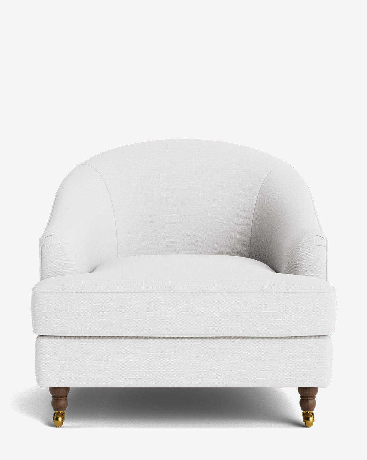 The Fletcher Lounge Chair features a curved backrest, plush white upholstery, and dark wooden legs with brass casters. This handcrafted armchair is available in customizable fabrics for a personalized lounge experience by McGee & Co.