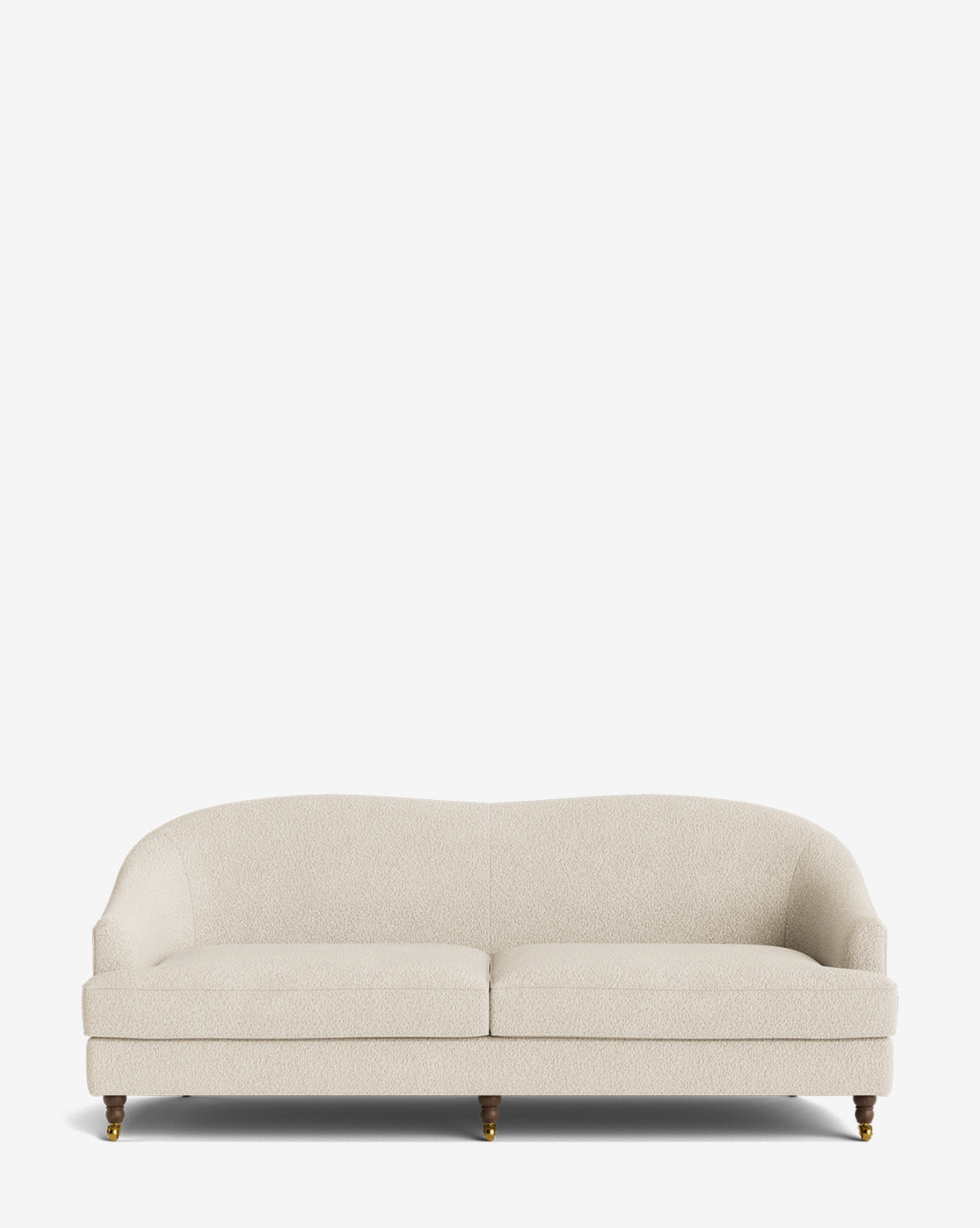The Fletcher Sofa 76 is a cream, upholstered, handcrafted sofa with two seat cushions, curved backrest, and four wooden legs with brass castors, shown against a plain white background by McGee & Co.