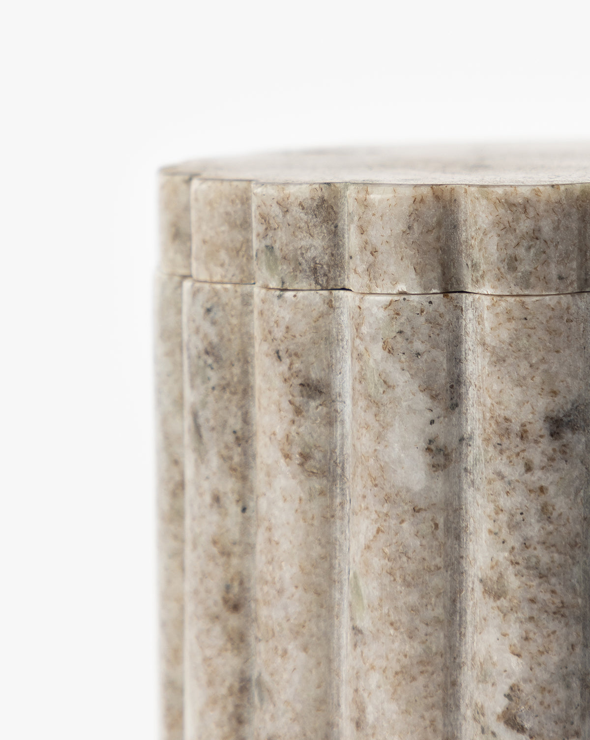 Close-up of the Forster Marble Canister, a cylindrical, light gray container with vertical grooves and a fitted lid, displayed against a white background—a stylish addition to modern home decor.