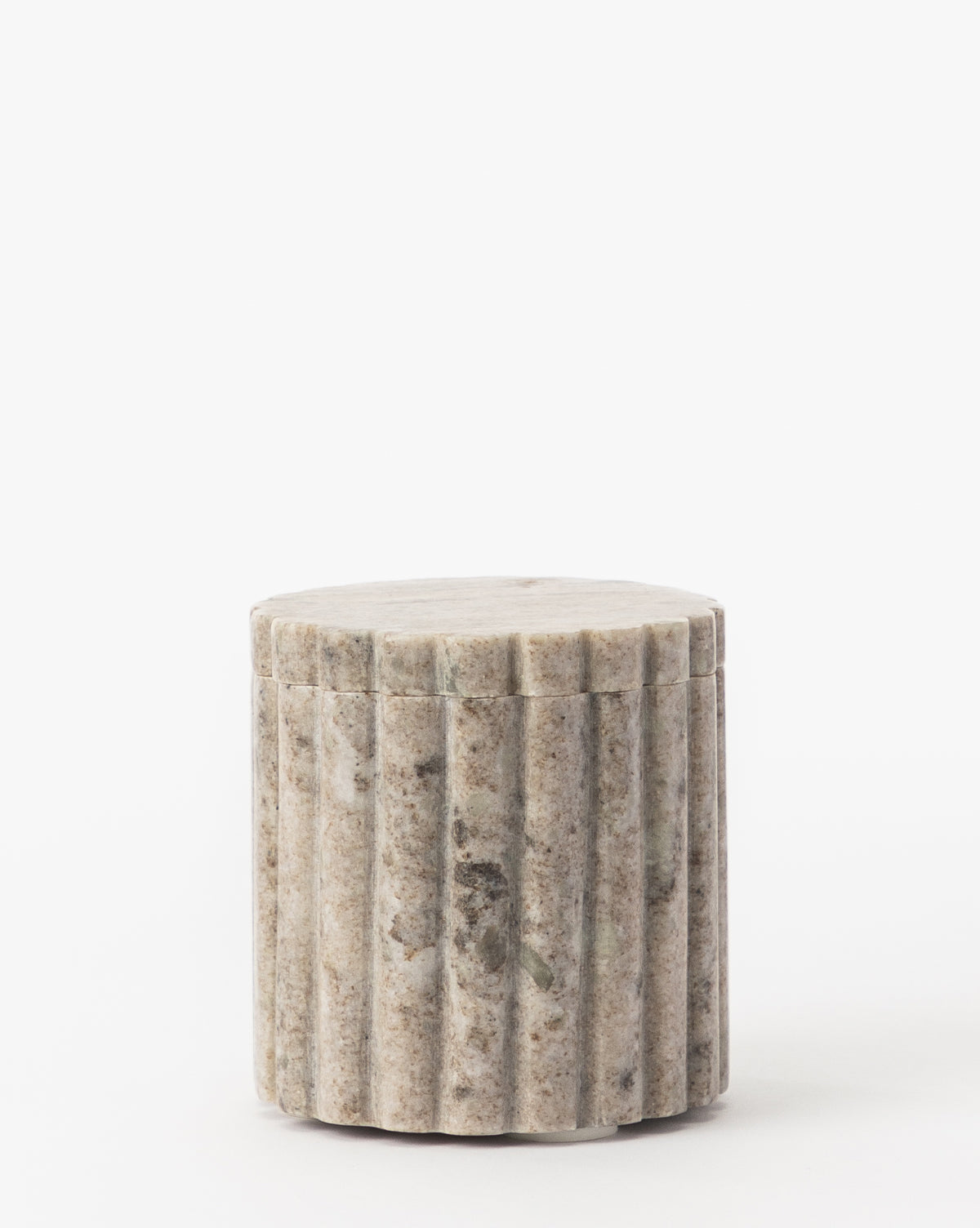 The Forster Marble Canister is a small, speckled stone canister with a removable lid and vertical grooves—an elegant home decor piece—shown against a plain white background.