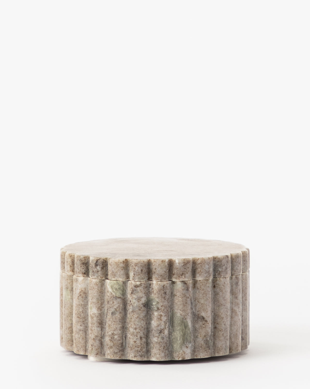 The Forster Marble Canister, a round light gray container with vertical grooves and a matching flat lid, is ideal for stylish home decor and shown against a plain white background.