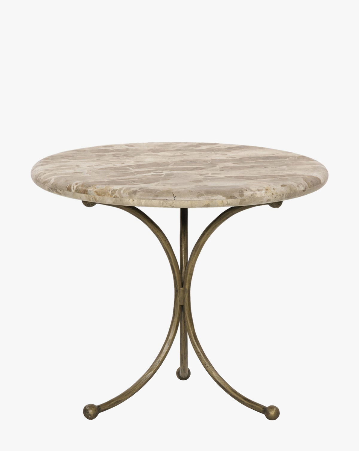 The Fossil Marble End Table showcases a round marble top with a light brown pattern and a curved sculptural base in hammered aged brass, combining an elegant smooth surface with an antique brass finish for timeless appeal, by McGee & Co.