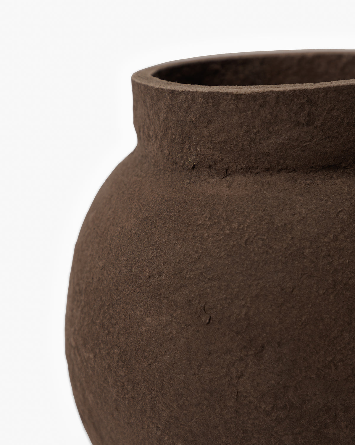 Close-up of the Frederick Paper Mache Vase, featuring a textured dark brown surface and wide opening. Only the upper part and one side of this handmade vase are visible, set against a white background, by McGee & Co.