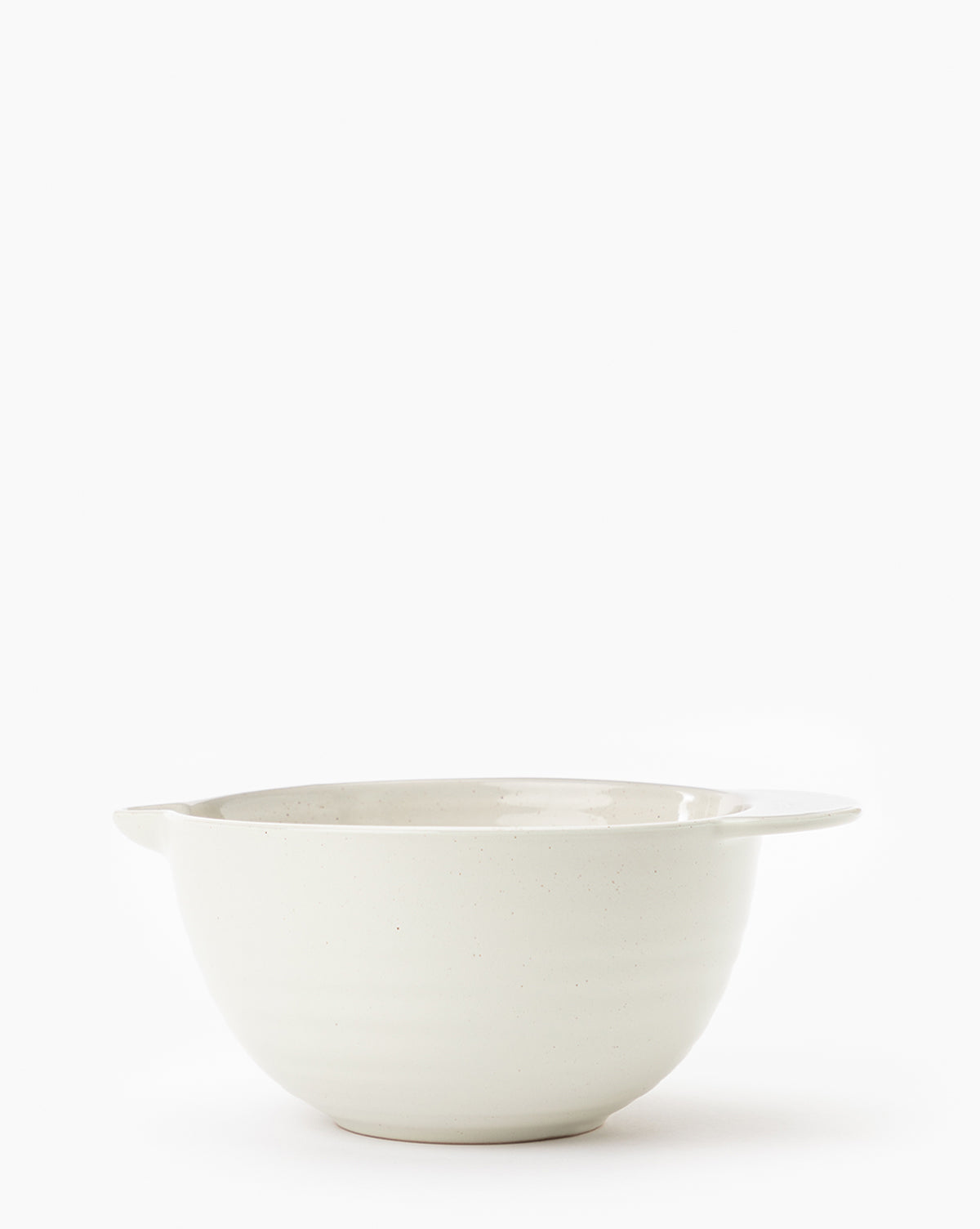 The Fullmer Stoneware Batter Bowl, in plain white with two small handles on opposite sides, is displayed against a white background by McGee & Co.