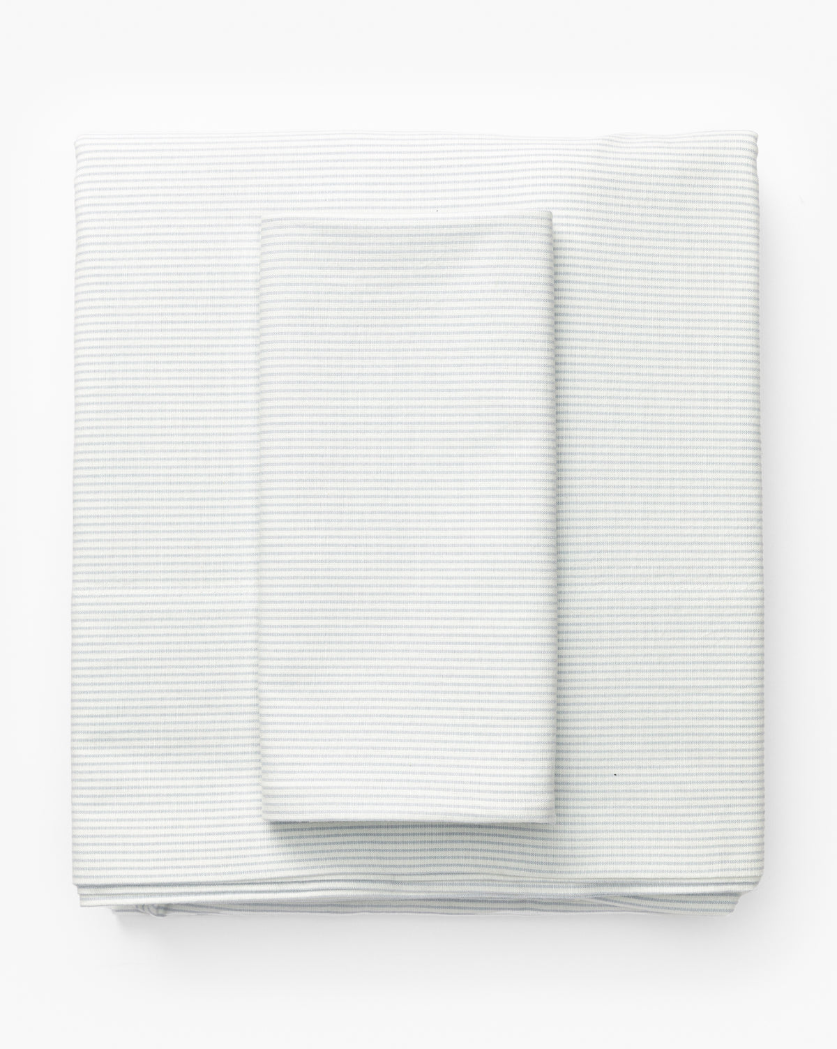 The Fulton Stripe Twin Kids Sheet Set, made from 100% cotton with a subtle striped design, is shown neatly folded on a white background—an ideal choice for childrens bedding, by McGee & Co.