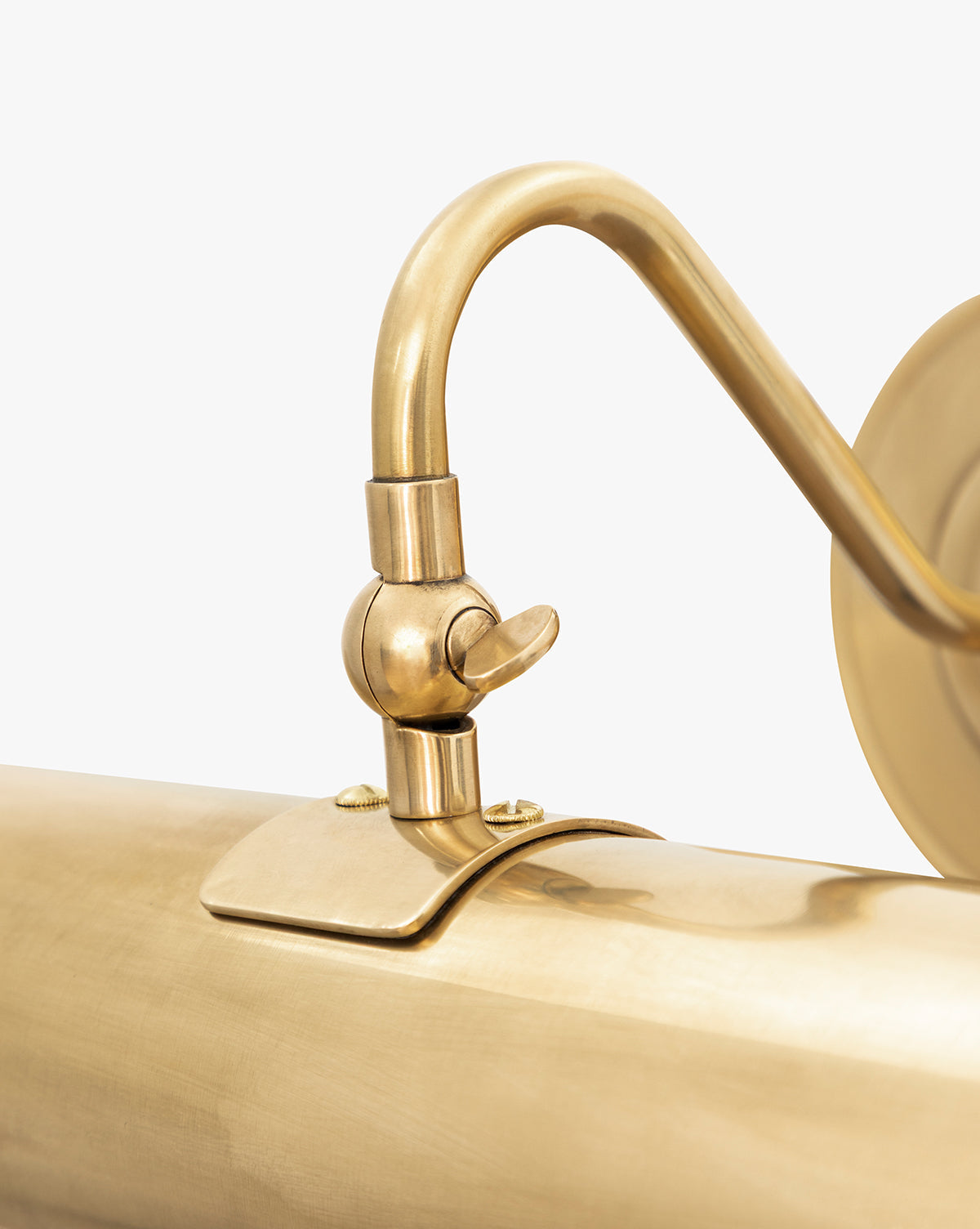 A close-up of the Gallery Picture Sconce in burnished bronze, showcasing its vintage-inspired design with a curved arm and adjustable joint, set against a plain white background, by McGee & Co.