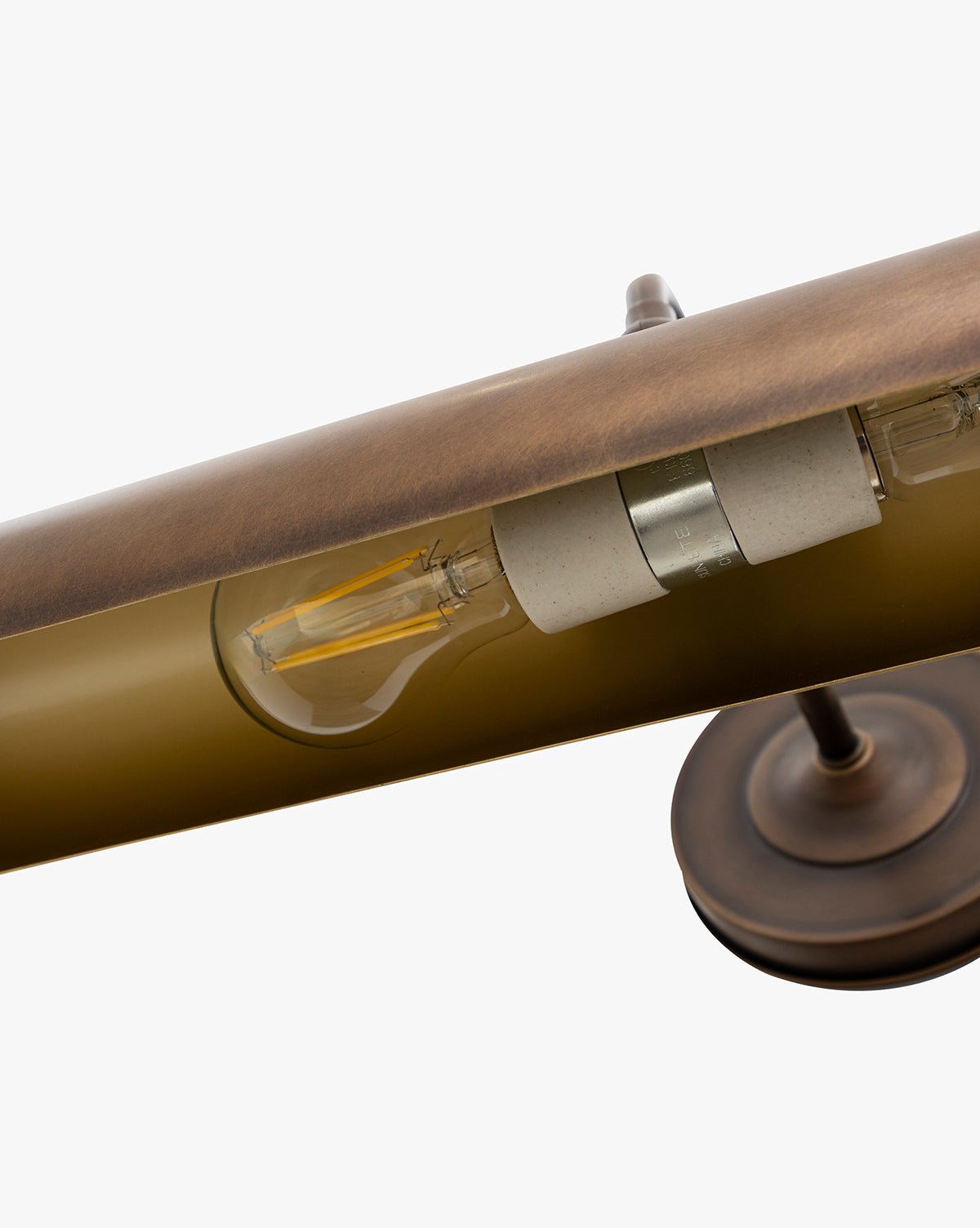 Close-up of the Gallery Picture Sconce, a vintage-inspired burnished bronze desk lamp with an exposed LED filament bulb and round base, displayed against a white background, by McGee & Co.