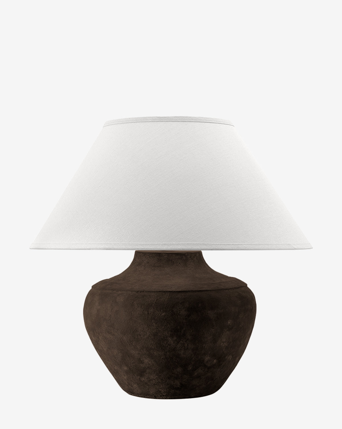 The Troy Lighting Gannon Table Lamp showcases an earthen-textured, round dark brown base with a wide white fabric shade, shown against a plain white background. McGee & Co.