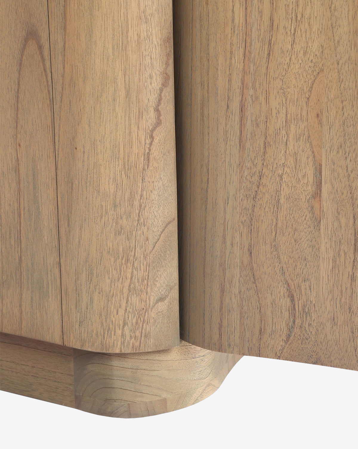 Close-up of the Gatlin Nightstand’s corner, crafted from solid mindi wood with smooth, rounded edges and visible wood grain—showcasing its quality as a stylish bedside storage solution by McGee & Co.