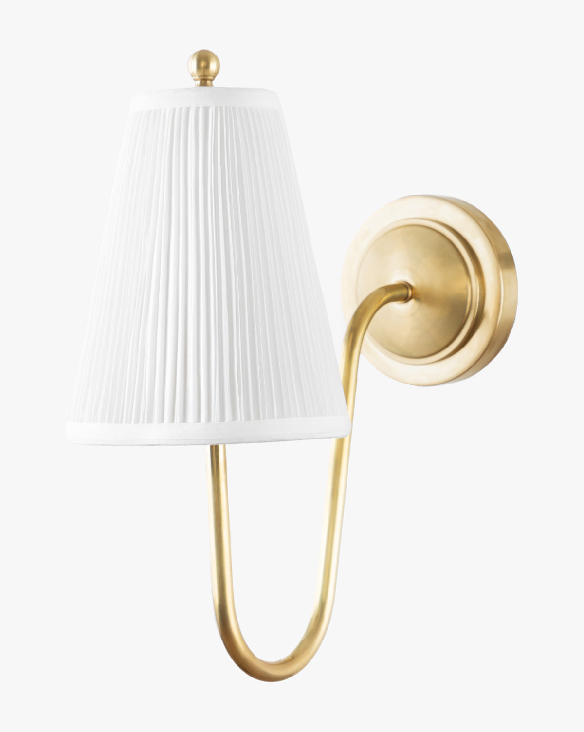 The Makerspalm Georgiana Single Sconce showcases an antique brass finish, curved arm, and round base, paired with a white linen pleated shade for timeless elegance. McGee & Co.